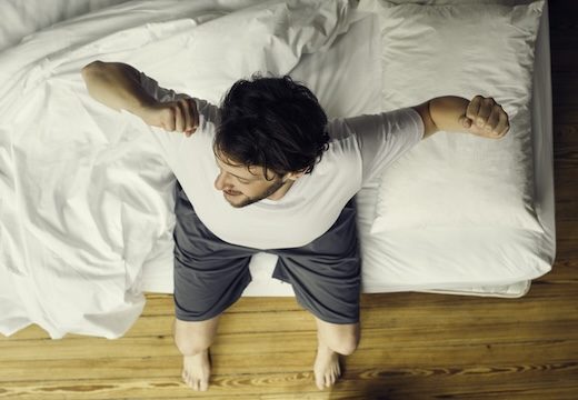Man beginning day with stretches